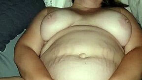 A mature woman pleasures herself after teasing with her ass
