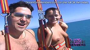 Three bikini-clad spring breakers go parasailing naked over the ocean