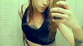 Beautiful transsexual in a mini skirt masturbates.