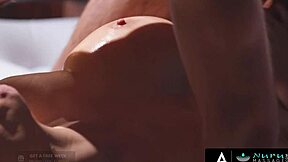 Busty masseuse gives a steamy Nuru massage for tuition