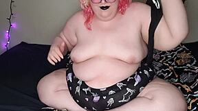 Gothic girl in black, alone, playing with herself and her big tits