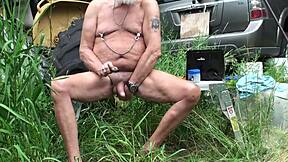 A middle-aged man uses a cock toy to pleasure himself