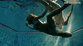 hot russian brunette babe posing erotically by swimming pool