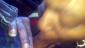 Black beauty gives a good blowjob in a car