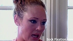 Fishnet-clad mistress enjoys foot worship and footjob
