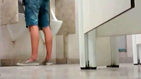 Amateur gay guys caught changing clothes in a bathroom