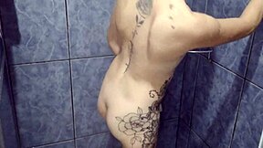 See-through shower fun with a tattooed teen babe