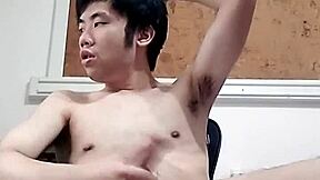 Raymonds Chen's massive cock cums hard in this gay porn video