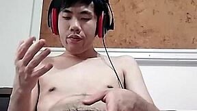 Raymonds Chen's massive cock cums hard in this gay porn video