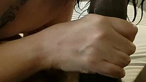 Mature woman gives a deep throat blowjob to a huge black penis