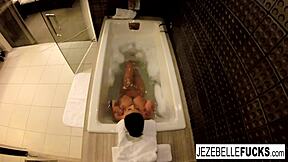 Brunette babe with big tits gets naughty in the bathtub