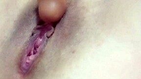 Attractive mature woman self-pleasures with a sex toy