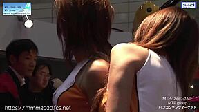 Amateur photographers capture young Japanese girls at the Tokyo Auto Salon
