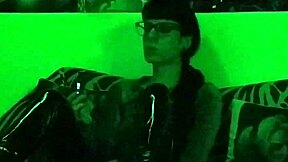 Beth's kinky side: A seductive goth mistress puffs on a cigarette under green light in high definition - Part 2
