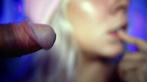 A stunning blonde beauty gives a close-up blowjob