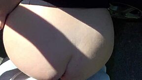 Tattooed babe takes on two cocks in public car sex