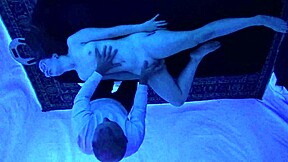 Gigi Breeze gives a sensual black light massage to a stunning teen