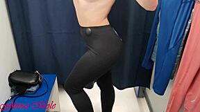 Anna Mole, a college girl with a stunning physique and petite breasts, indulges in various yoga pants in a change room