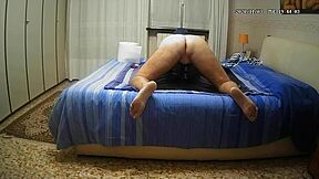 Gay man pleasures himself on his bed