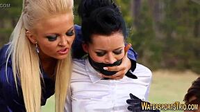 Glamorous lesbians indulge in outdoor golden showers