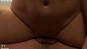 Holly with big natural breasts gives a blowjob to a large penis