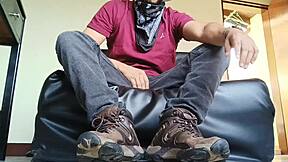 A young man in a hat and jeans strips down and ejaculates intensely