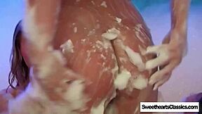Three babes indulge in steamy threesome in remastered foam bath video