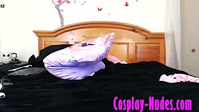 A young and petite cosplay girl undresses and masturbates in a steamy video