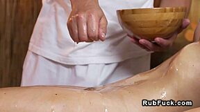 Massage therapist rides large-endowed partner's penis during erotic session