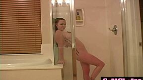 Redhead gets wet and pleasured in the shower