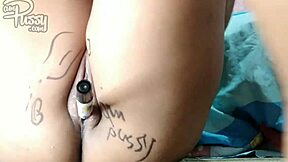 Close-up of hairless Asian pussy being penetrated with marker