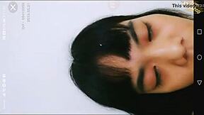 Amateur Asian teen masturbates with a bottle