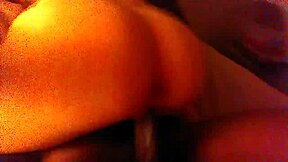 A petite girl rides a big black cock