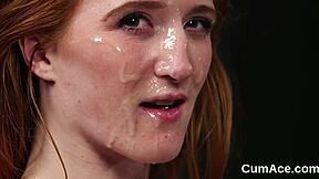 A lustful woman receives a load of cum on her face, consuming every last drop