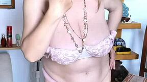 Seductive mature woman Mariaold teases with her natural assets and red toy
