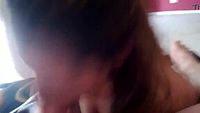 Petite brunette amateur wife gives a POV blowjob to a well-endowed man