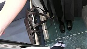 Busty Japanese couple indulges in public train handjob and blowjob escapade