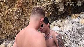 Gay men having sex on a nude beach in public view