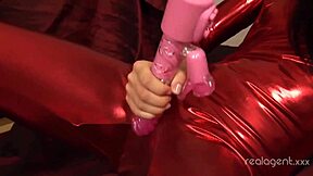 Sasha Rose teases her red dress and herself with a long toy