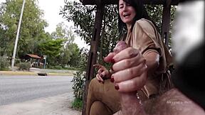 Man jerks off random guy's cock in public