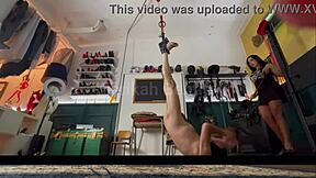 Suspended sissy in brutal BDSM scenario