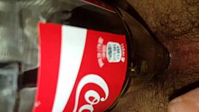 Youthful gay engages in intense sexual encounter with a cola bottle