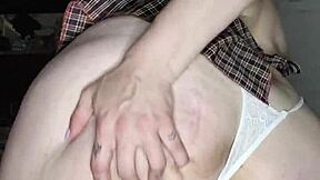 Green-eyed blonde masturbates with a dildo