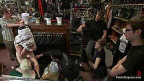 Public shop BDSM scene with bondage and hardcore sex