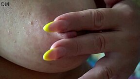 A mature Russian woman in leopard underwear has sex with a dildo and then spits on her breasts.
