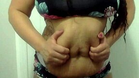 Beautiful black MILF shows off her curves in a bathroom dance routine