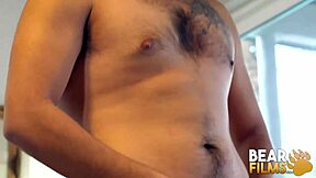 Avi Strider, a hirsute gay man, blindfolded while pleasuring himself in Bearfilms.
