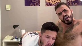 Muscular coach seduces his player in the locker room.