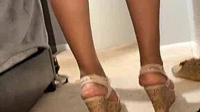 Beautiful woman showing off her legs and ass in pantyhose.