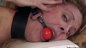 Big-boobed blonde on knees and bound for anal sex